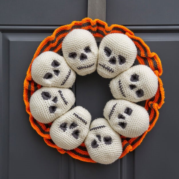 Halloween Circle Of Skulls Wreath hanged on the door