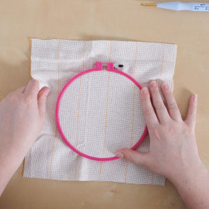 Step 1: Ring on cloth and punch needle