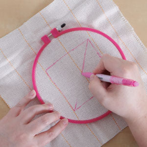 Step 2: Ring on cloth and designs using punch needle on cloth