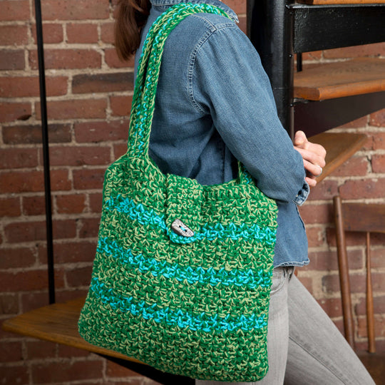 Knitted String Bag Weighs On A Vintage Brick Wall Stock Photo