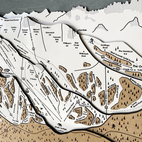 Layers of wood enhance mountain peaks and contours. 