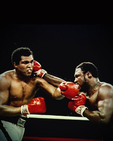 Muhammad Ali dodging punch and hitting back