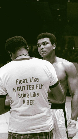 Muhammad Ali getting ready to fight and his coach