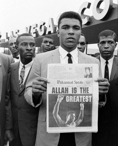 Muhammad Ali holding journal "Allah is the greatest"