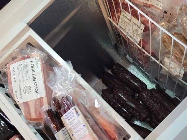 freezer filled with cuts of farm raised meats