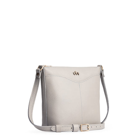 Nimbus | Rectangular side bag with curved front pocket and metal tree shaped badge