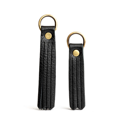 All Color: Pebbled--black | slim leather tassel with brass ring