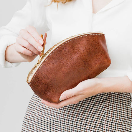 Nutmeg | Spacious leather makeup bag with curved seams and top zipper