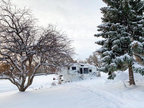 The Tabin's camper in deep snow, with a path leading to the doorway