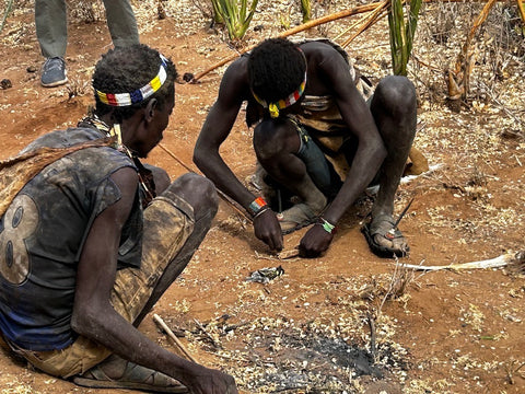 Hadza hunters making fire near Lake Eyasi, Tanzania