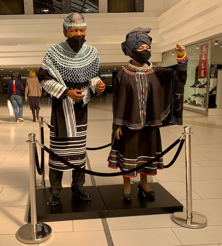 Mandela and Graca in traditional attire Sandton shopping center Johannesburg