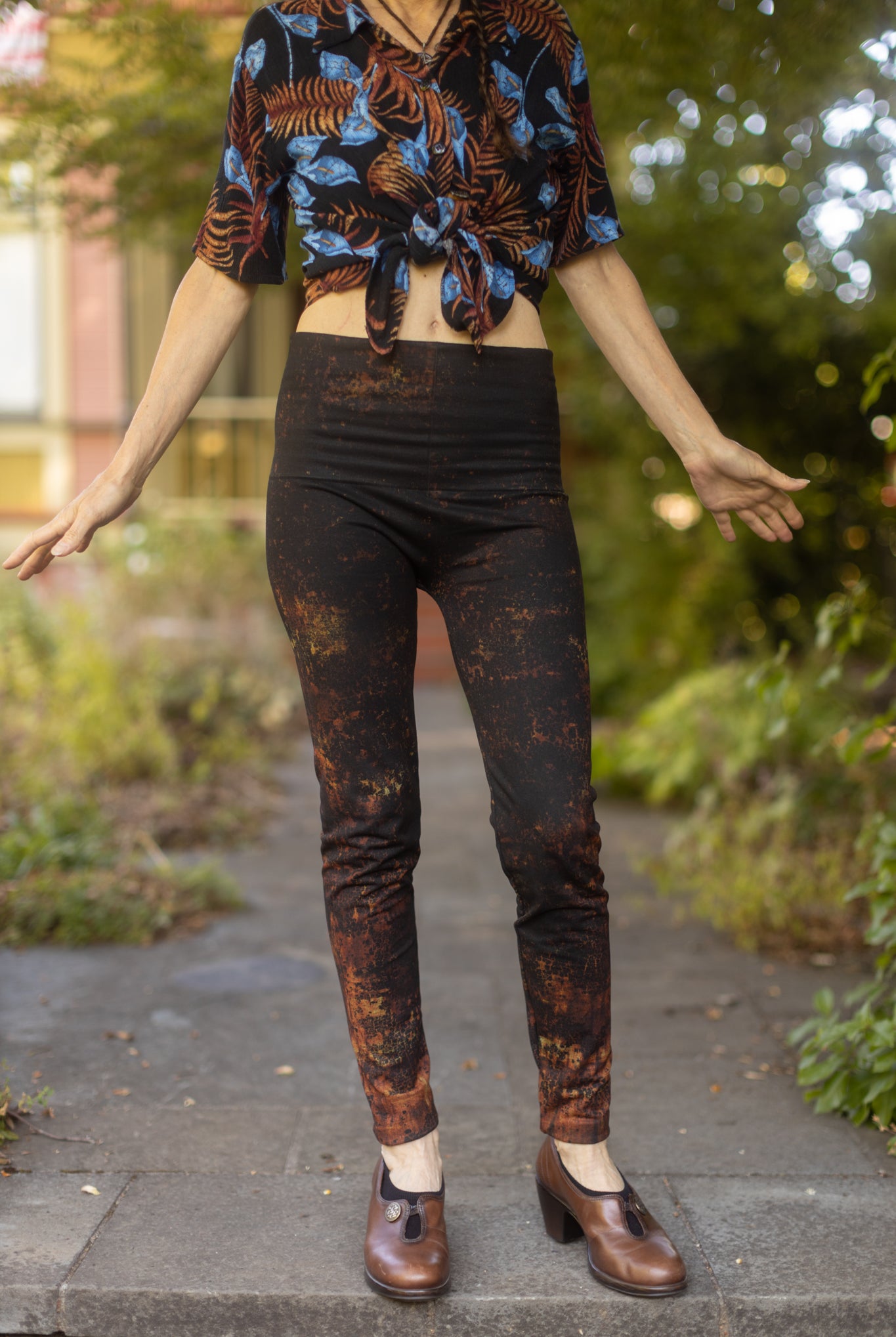 Black and brown floral printed leggings. Polyester spandex blend