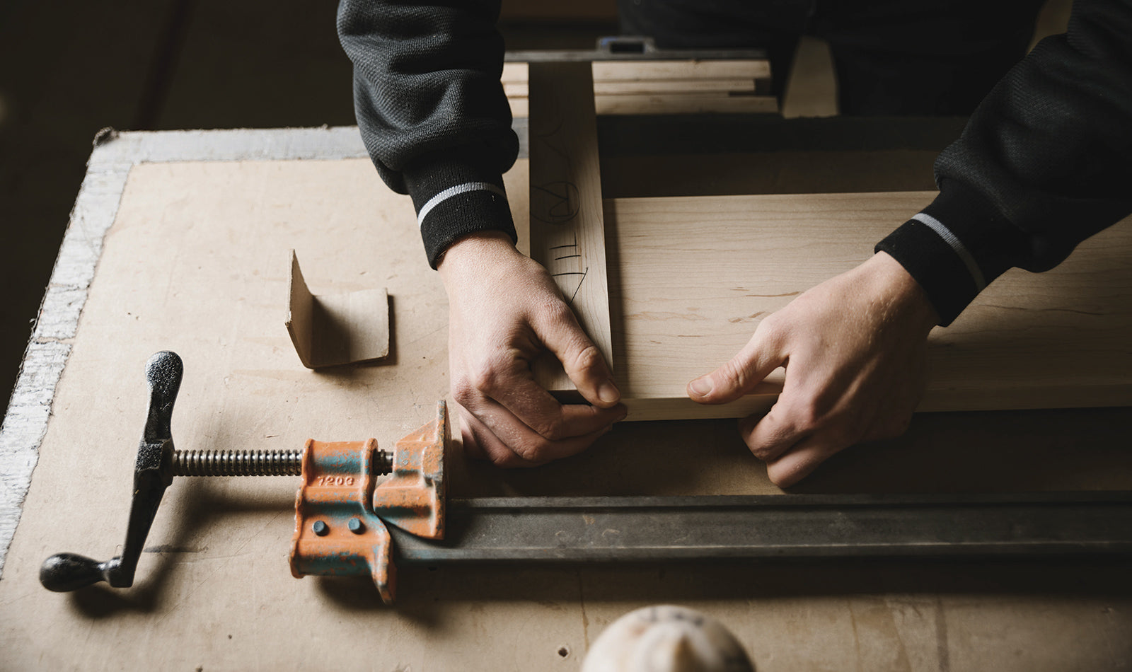 Man's hands working on furniture