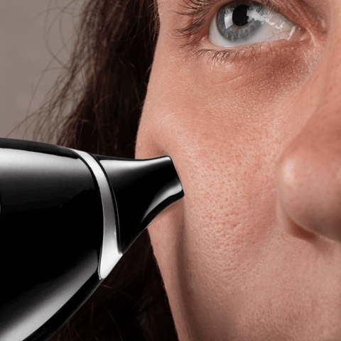 woman using blackhead comedo suction