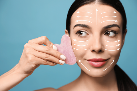 woman using rose gua sha