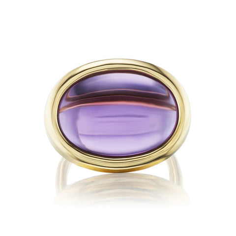 Large cabochon amethyst or citrine in three-tiered yellow gold setting.