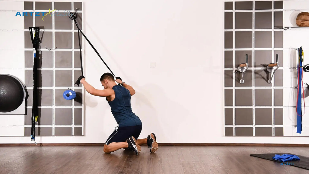 Man performs the Lat Pull exercise with a TheraBand.