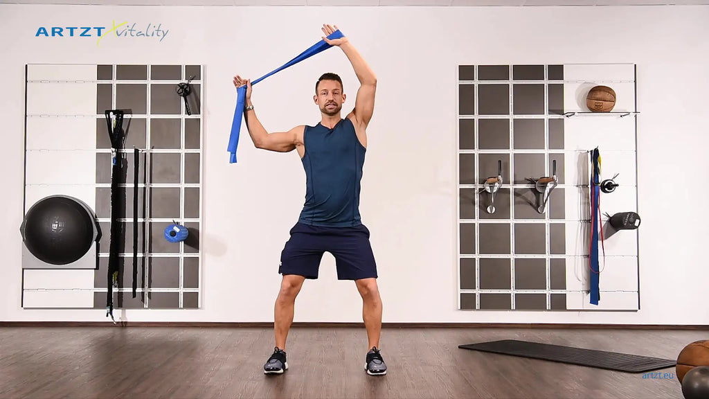 Man performs the One Arm Bandit exercise with a TheraBand.