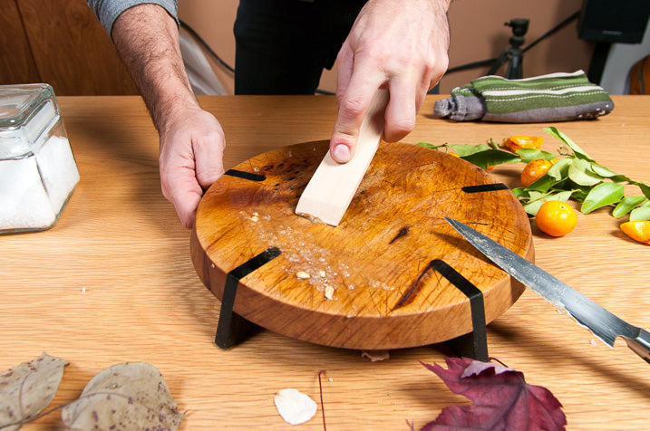 cutting board being cleaned and oiled