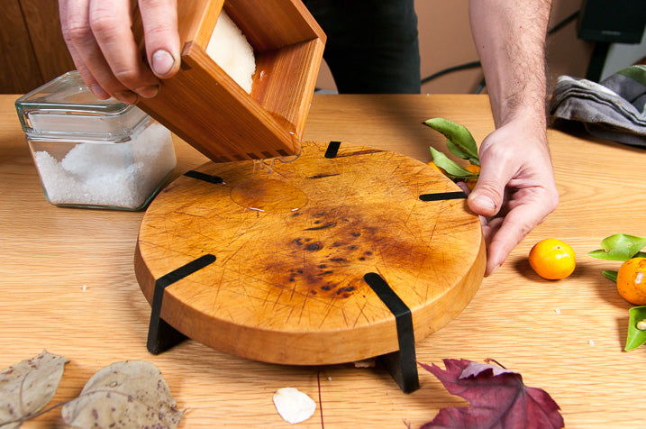 cutting board being cleaned and oiled