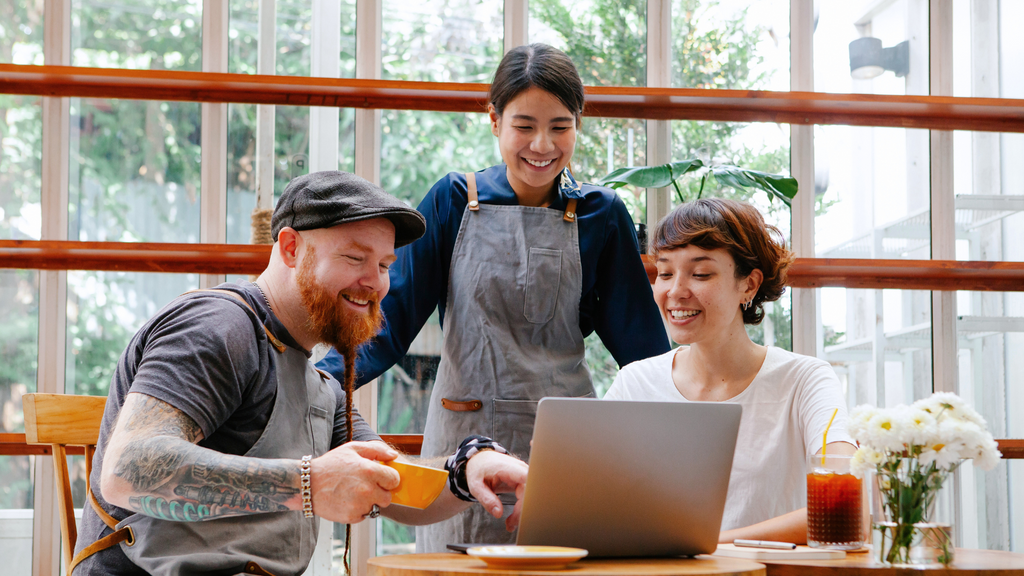 happy employee and customers at a local business