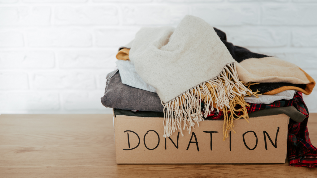 donation box full of scarves and other clothing items