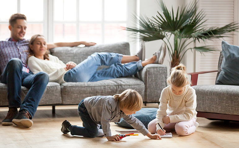 Wood floors finished with non-toxic Rubio Monocoat Oil Plus with children playing.