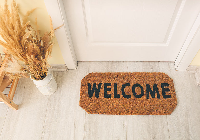 Rug placed by front door to protect hardwood flooring.