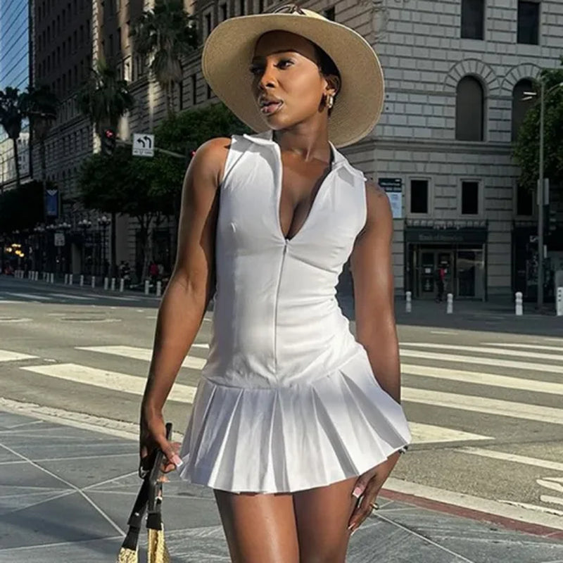 Solid white pleated mini dress: elegant, casual, summer street style.