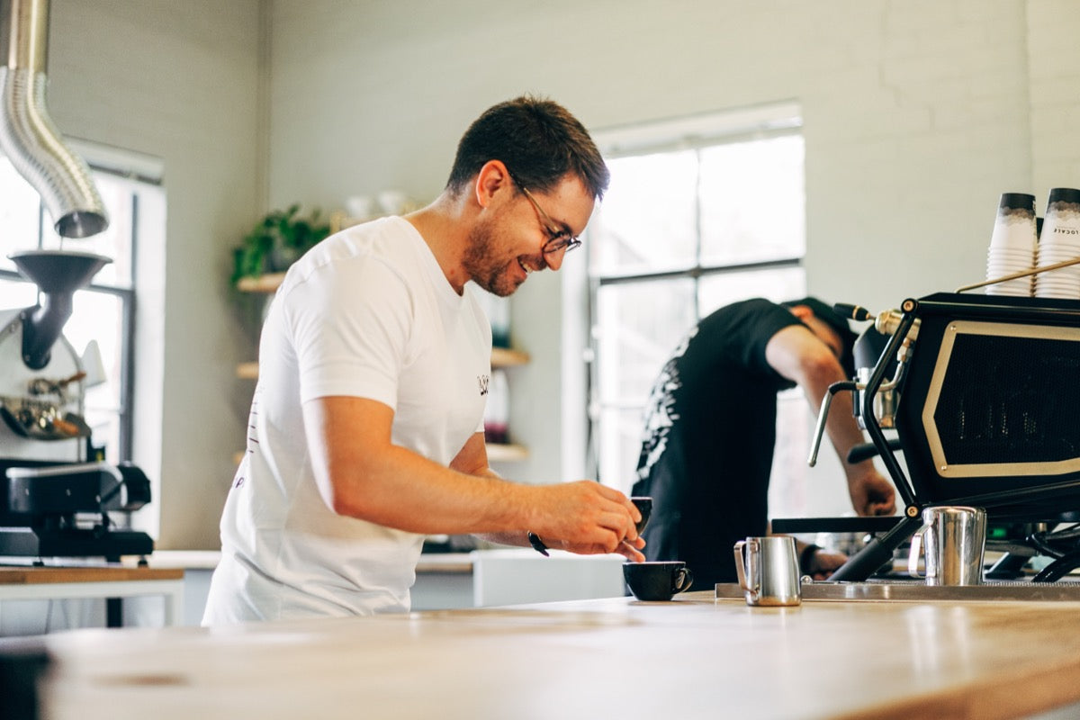 A member of the Locale Coffee Roaster team prepares a coffee.