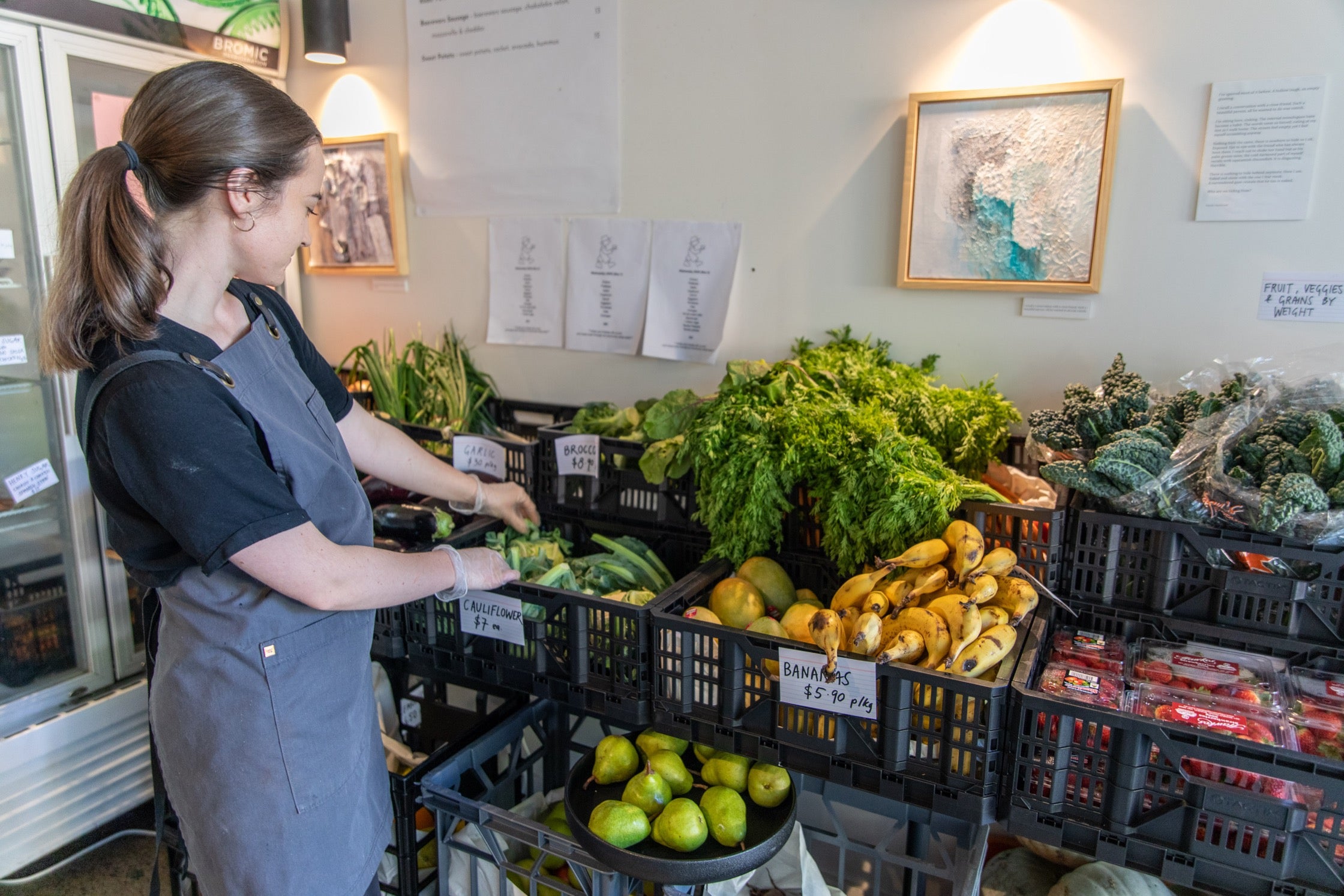 Ruby arranges cauliflowers at the Tanaka grocery.