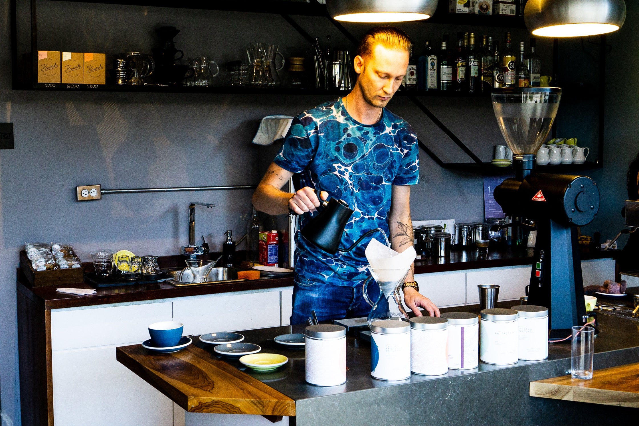 A Franco employee preparing coffee.