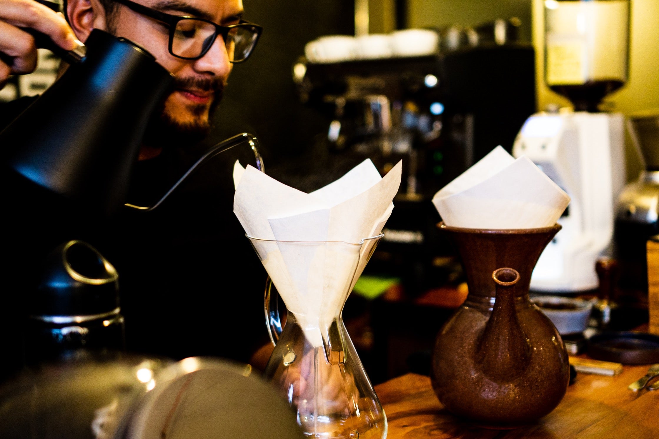 Jose prepares coffee at Underground Brew Cafe