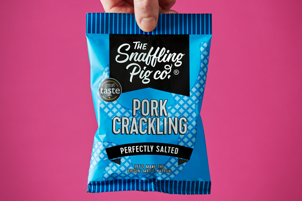 Snaffling Pig Perfectly Salted Pork Crackling on Pink Background