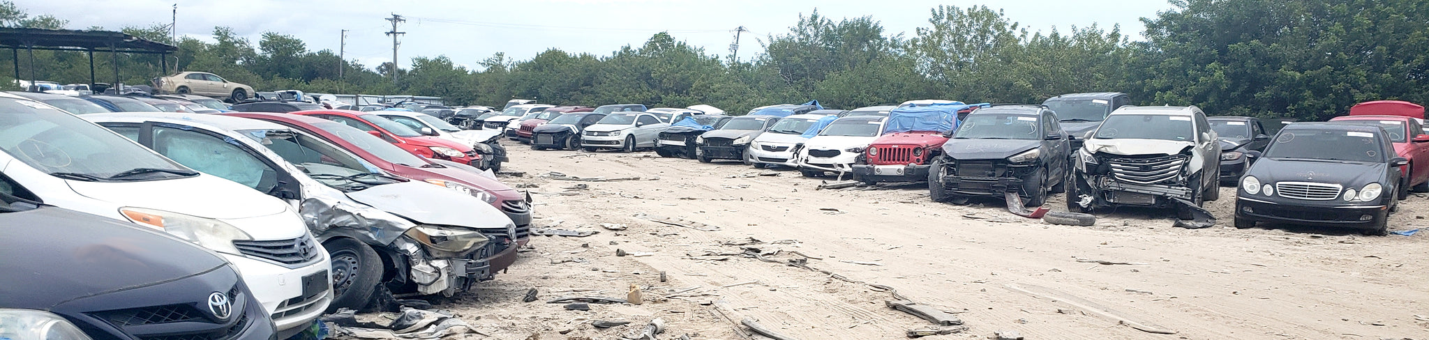 Salvage Yard Aisle with Dismantled Vehicles