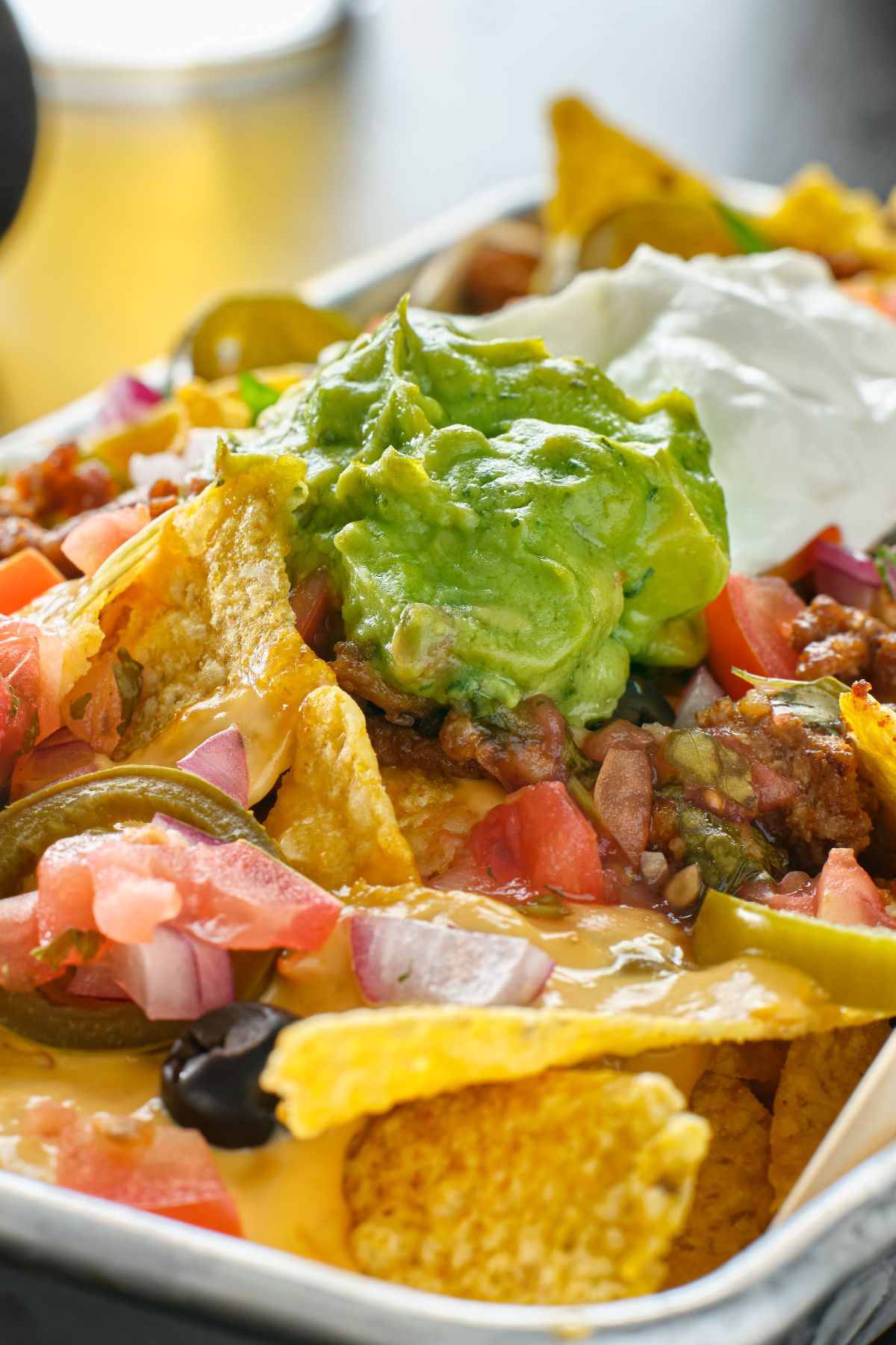 nachos with guacamole and meat