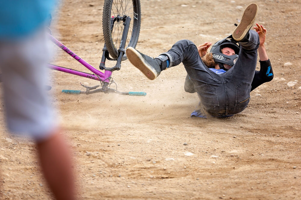 Jake falls off of his bike