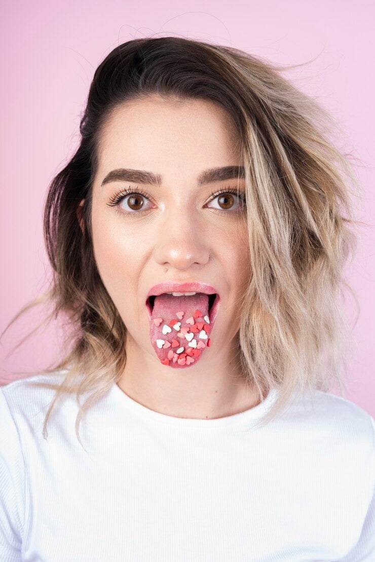 Close-up of a person holding a sugar cube, symbolizing the impact of quitting sugar on health.