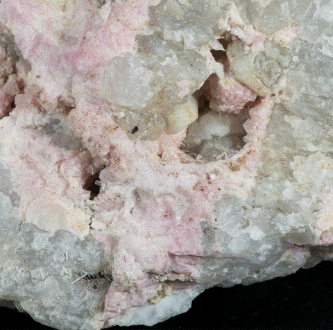 close up of tugtupite crystals