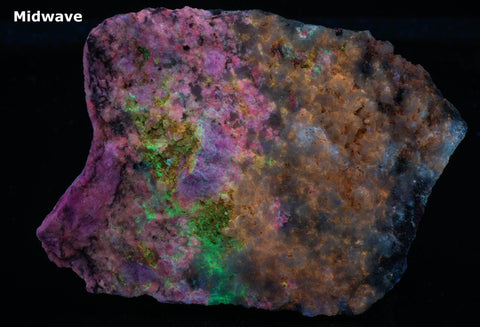 An incredible, unusual gemmy and extremely tenebrescent tugtupite specimen from Kangerlussaq. Vugs with large and well-formed, gemmy tugtupite crystals