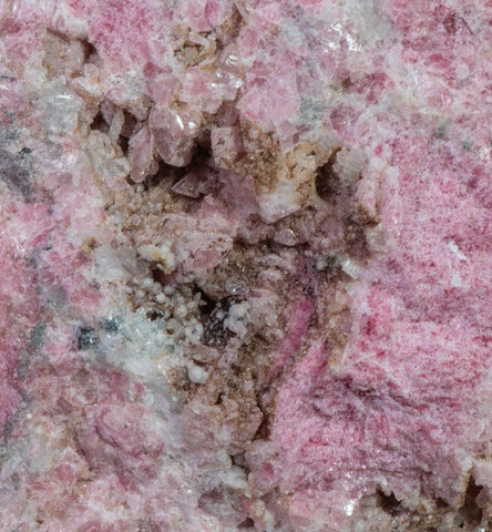 An incredible, unusual gemmy and extremely tenebrescent tugtupite specimen from Kangerlussaq. Vugs with large and well-formed, gemmy tugtupite crystals