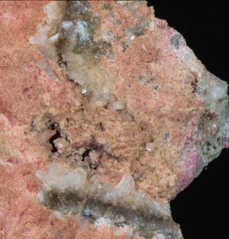 close up of tugtupite crystals