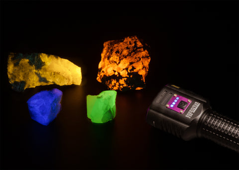 A UV flashlight shining a group of rocks