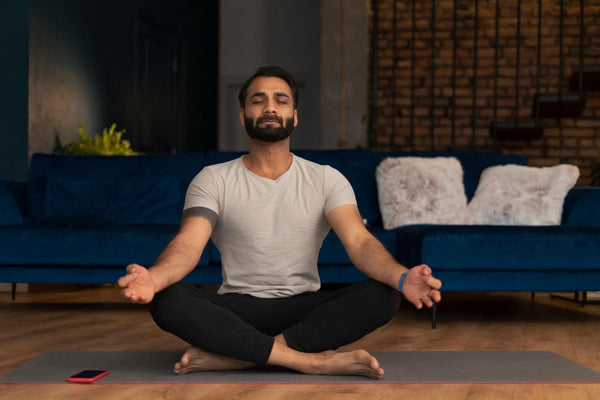 The man is practicing meditation