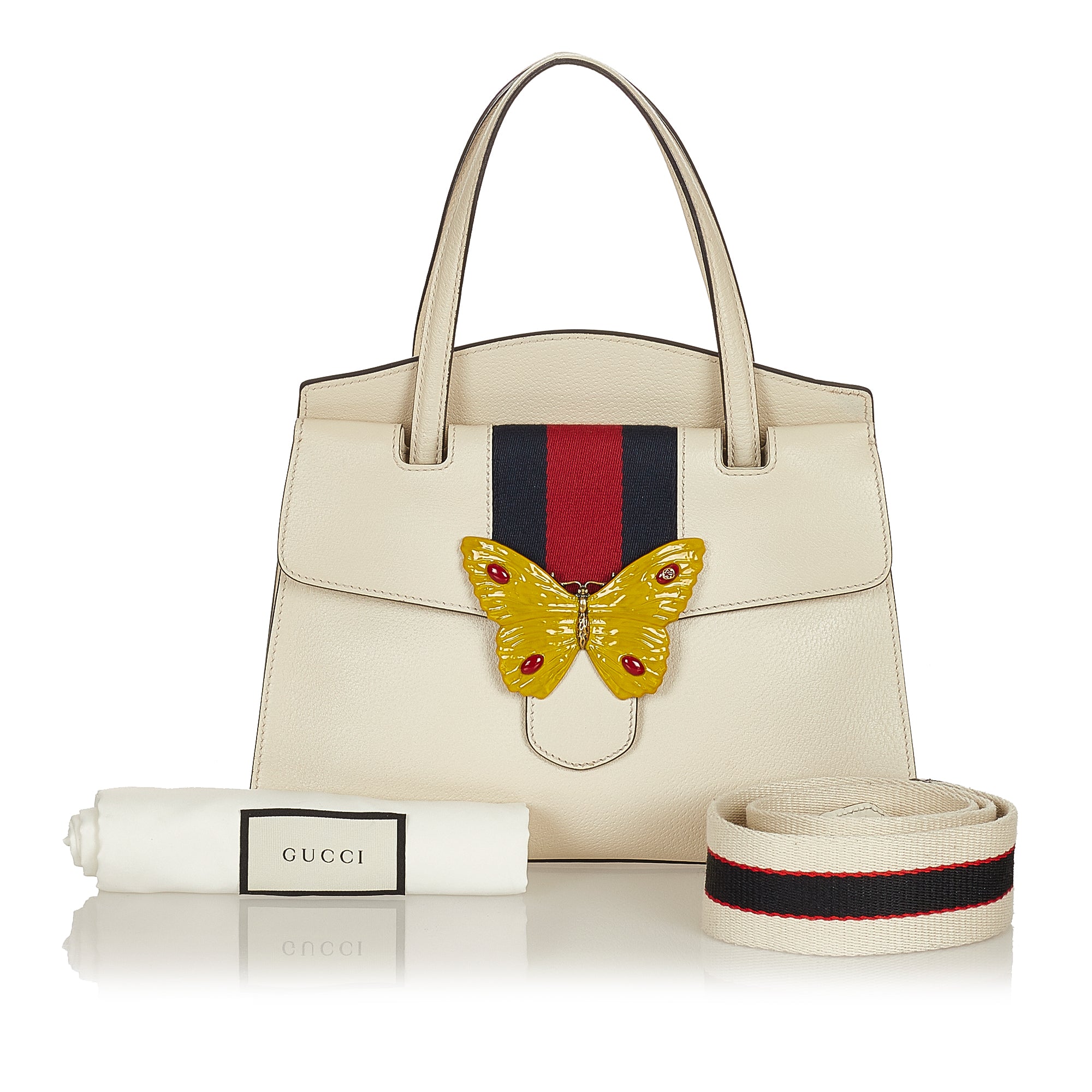 white gucci bag with butterfly