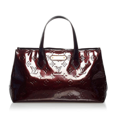 Lot 681 - A Louis Vuitton Red vernis leather Wilshire