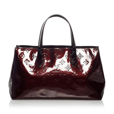 Lot 681 - A Louis Vuitton Red vernis leather Wilshire