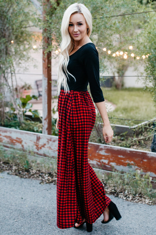 red long skirt and black top