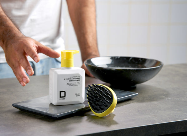 man reaching for densify shampoo