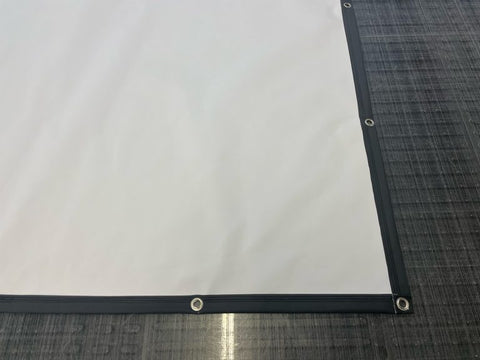 Grommets on fabric with hem for stage backdrops and trade show backdrops. 